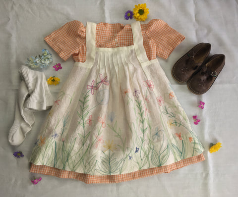 Photo of Folkwear 213 Child's Prairie Dress Pinafore with tights and shoes