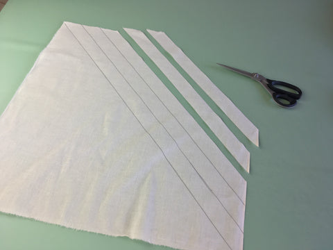 Photo of bias strips cut from fabric square
