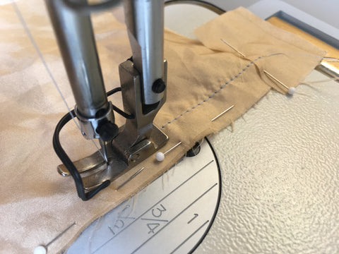 Photo of stitching to prevent slippery silk fabric being pulled down into stitch plate