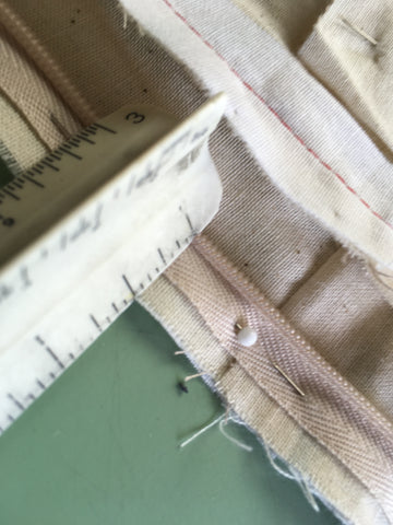 Photo of measuring to align zipper coil to seam allowance