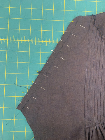 pinned  facing J faced down revealing previous stitching line.