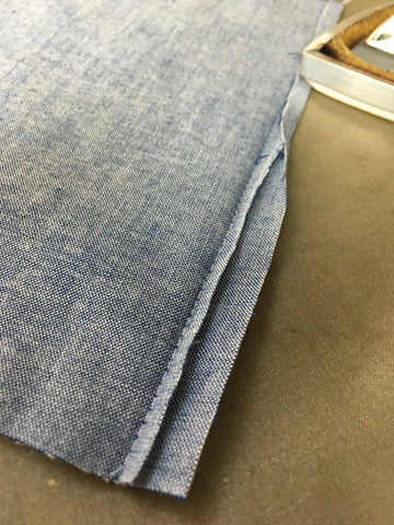 Step Three to Making Flat-Felled Seams: wider edge turned under to stitch line and pressed
