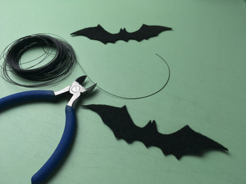 Photo of cut out felt bats and wire to give make wings stand up