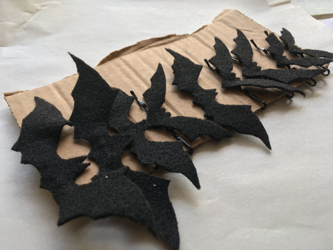 Photo of bat hair pins attached to cardboard