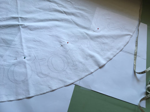 Photo of quote seen through the fabric to trace.