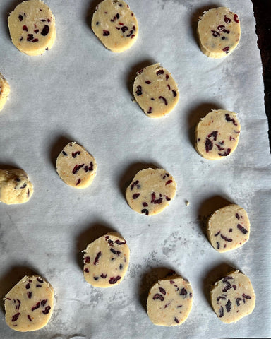 Orange cranberry shortbread raw dough on a cookie sheet ready to cook.