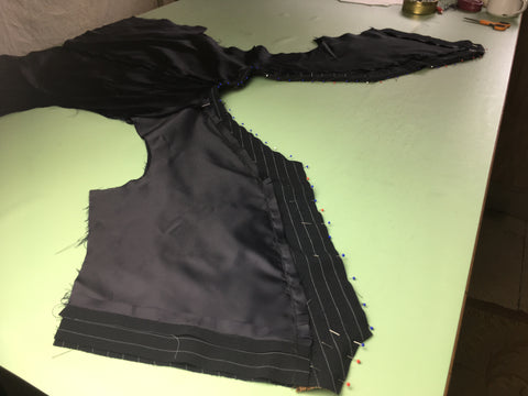 Photo of Vest and Lining pinned together for stitching