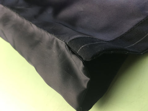 Upclose photo of side seam lining hand stitched