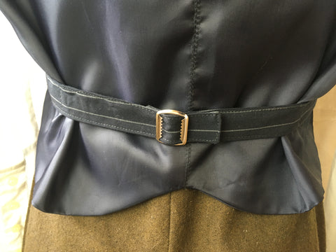 Photo of belt buckle added to back of vest