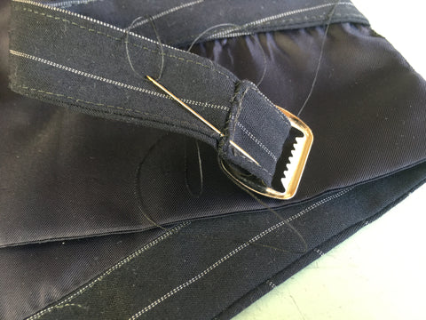 Photo of belt buckle handstitched to vest belt