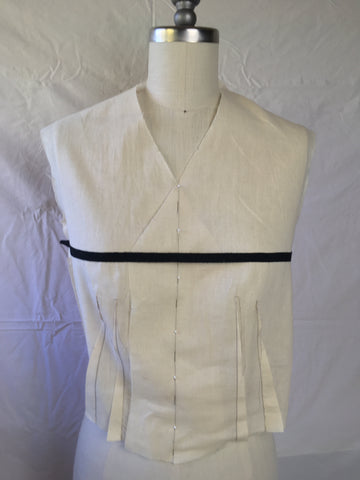 Photo of front view of 222 Vintage Vest View C Muslin with black ribbon stretched across fullest point of bust