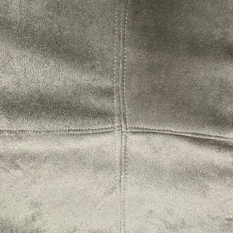 Close up of top stitched seams on grey skirt