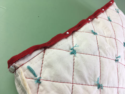 Photo of bias tape on tea cozy edge turned and pinned to hold