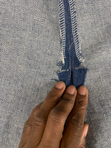 clipped denim fabric on either side of the dot for the back slit.