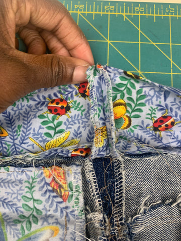 Waistband curtain in botanical blue and orange fabric is sewn right sides together.