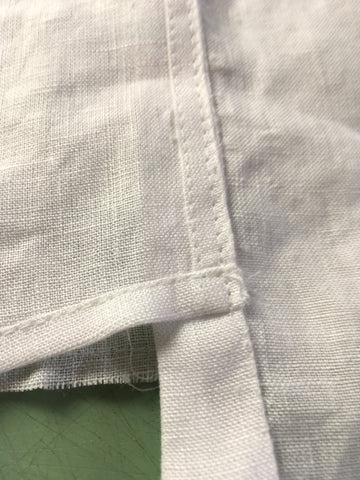 Up close photo of bottom edge of Vestee sewn to bottom of Folkwear 210 Armistice Blouse edge