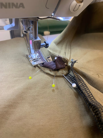 Close up of sewing machine topstitching the pressed Left Fly/Facing D down through all layers including the Left Front Pant A with zipper tape out of the way.