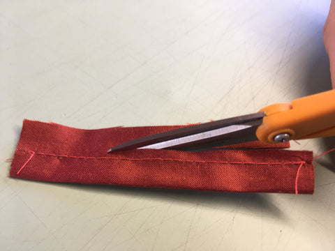 Photo of trimming away loop seam allowance