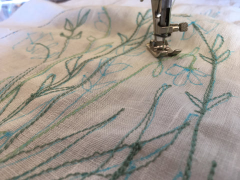 Photo second upclose of using the traced design to stitch the 213 pinafore design