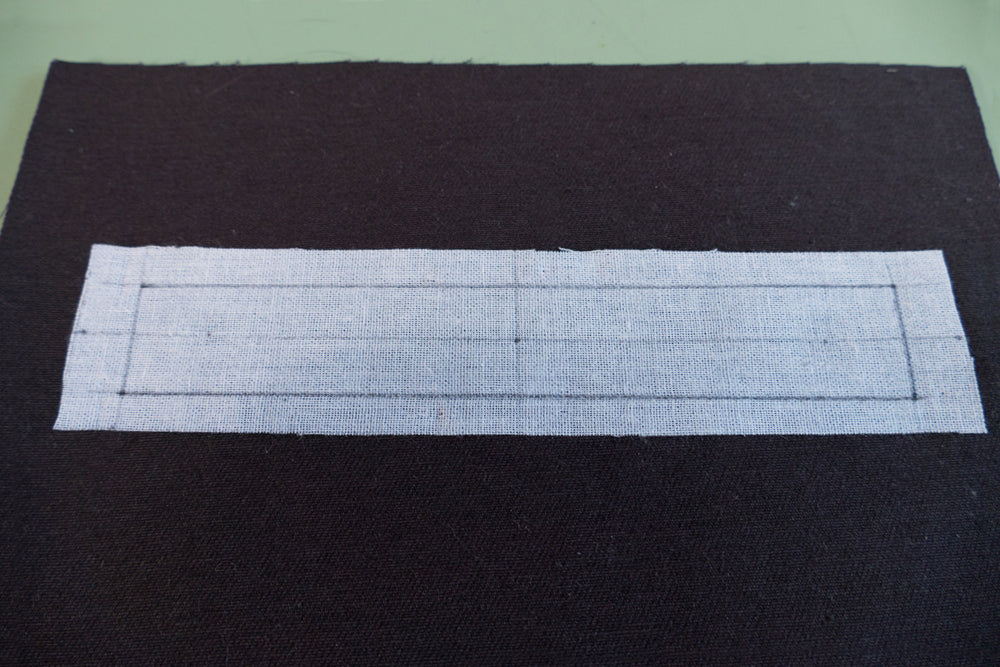The rectangular pocket opening guide drawn on the fusible interfacing.