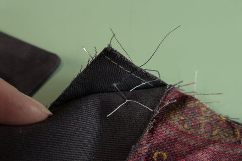 Using a pin align the dots at the top of the Front Dart Gusset and the pants.