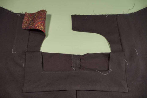 Front of the pant showing the Front Buttonhole Facing folded down revealing the Front Dart Gusset Facing.