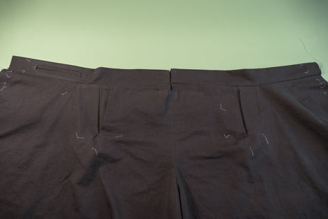 The outside of the pant with the Front Buttonhole Facing folded up.