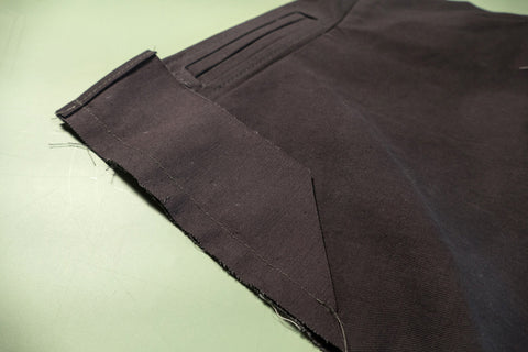 One Center Back Eyelet Facing sewn to one back edge of the pants.