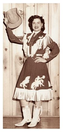 Patsy Cline in western fringe and appliqued skirt and jacket.