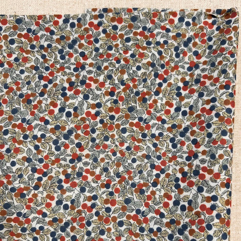red and blue berries and leaves printed cotton fabric
