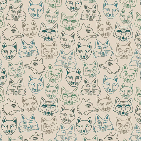 cream colored flannel fabric with fox faces printed on it.
