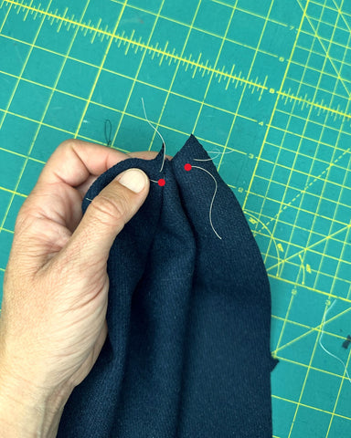 sewing first dart on a navy wool hat