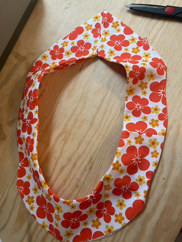 finished yoke circle of orange floral fabric