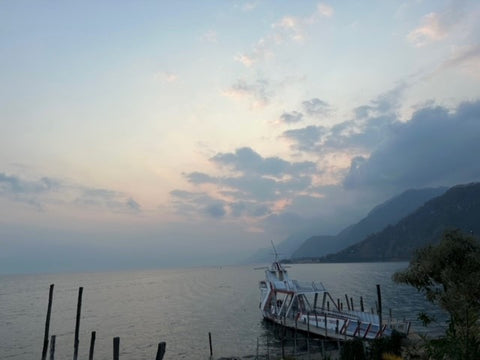 Picture of Lake Atitlan with boats in the foreground.