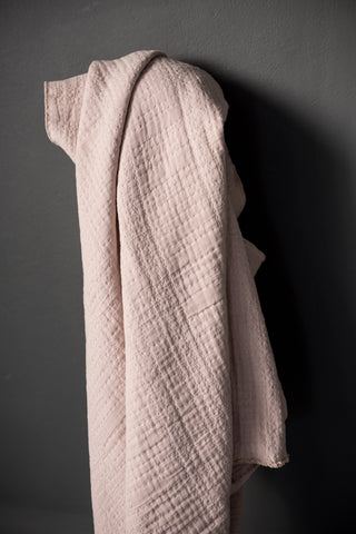 pale pink jacquard fabric with a dark grey background