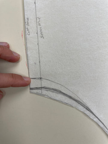 Pattern piece with pencil markings showing seam lines