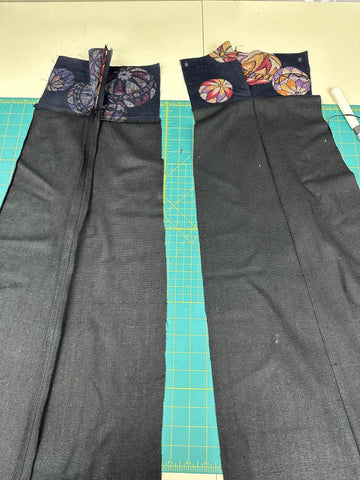Black and printed fabric sewn together into panels