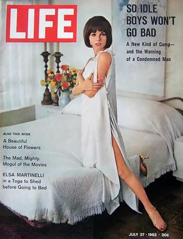 Cover of Life Magazine with a Sylvia Pedlar designed white sleeping toga on a woman kneeling on a bed.