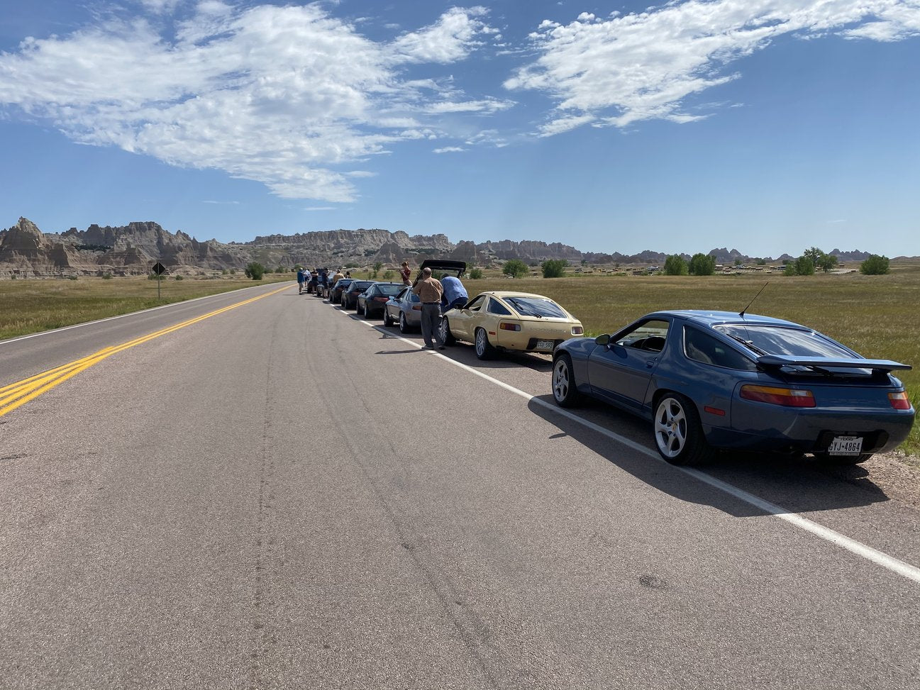 sharks in the badlands 928s event parked at the side of the road