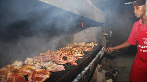 Meat on the braai at Mzoli's, Cape Town