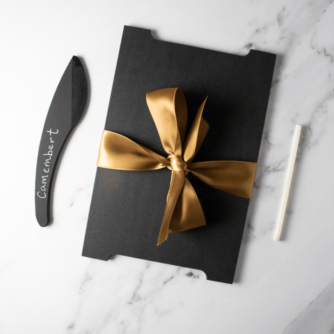 black slate board with black cheese knife