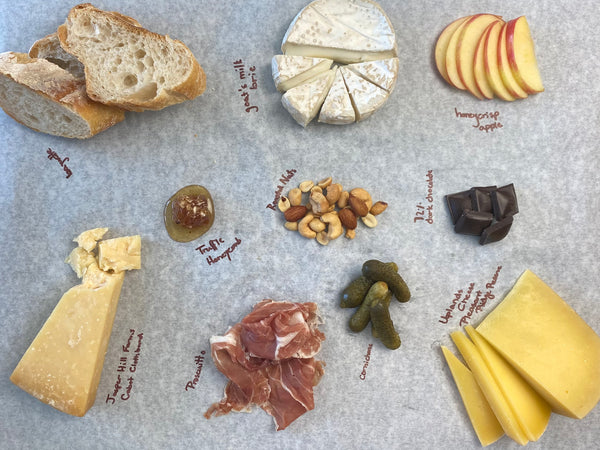 documenting cheese pairings on butcher paper