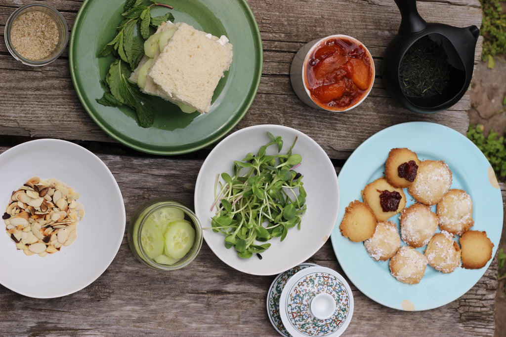 afternoon tea with cucumber cream cheese sandwiches and cookies