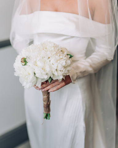 Hi Cacti Brings Tropical Florals to Larmar Tree Gardens Wedding vegan eco friendly sustainable england bride and groom roman temple palms babies breath vases tropical plants white peony bouquet bridal