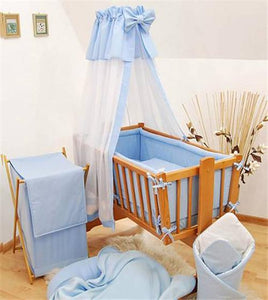 swinging crib with drapes
