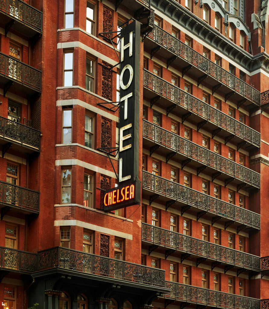 The iconic Hotel Chelsea sign adorns the front of the building on 23rd Street