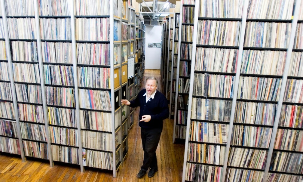 Bob George in his ARChive of Contemporary Music LP stacks.