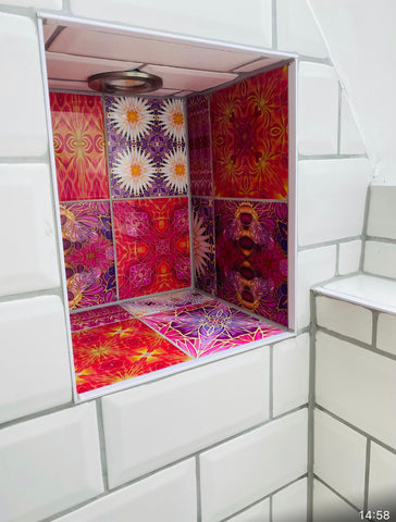 Bright mixed patterned tiles in bathroom nook