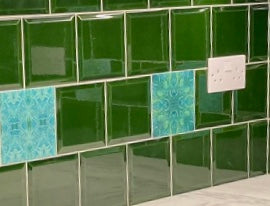 Mixed patterned and plain green tiles