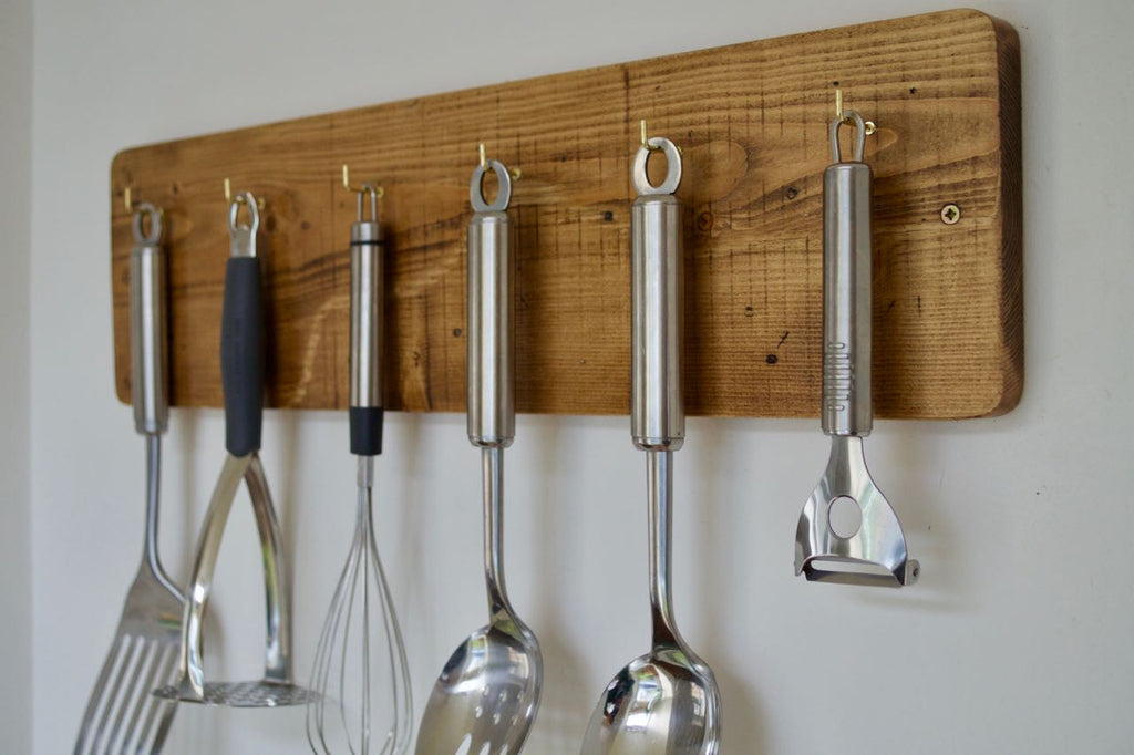 wood utensil wall kitchen